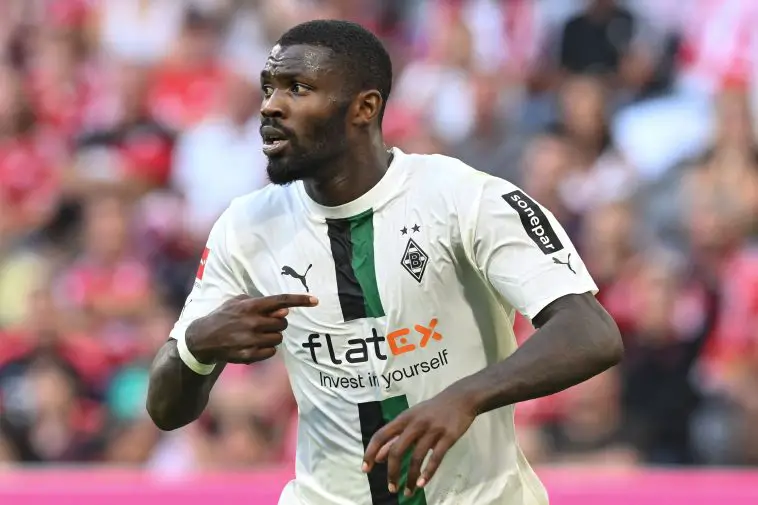 Moenchengladbach's French forward Marcus Thuram celebrates scoring the opening goal during the German first division Bundesliga football match between Bayern Munich and Borussia Moenchengladbach in Munich, southern Germany on August 27, 2022
