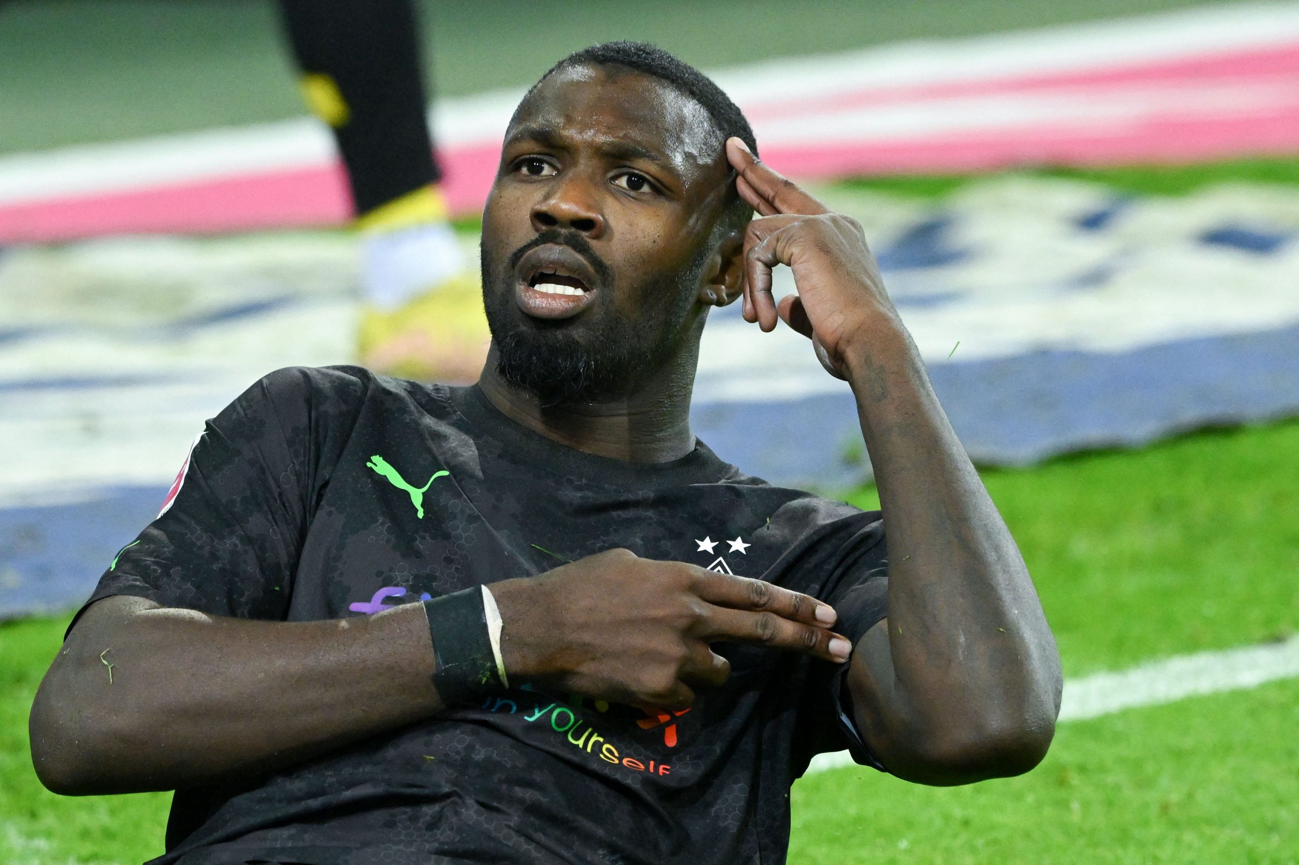 Moenchengladbach's French forward Marcus Thuram celebrates after scoring a goal during the German first division Bundesliga football match between Borussia Moenchengladbach v Borussia Dortmund in Moenchengladbach, western Germany, on November 11, 2022