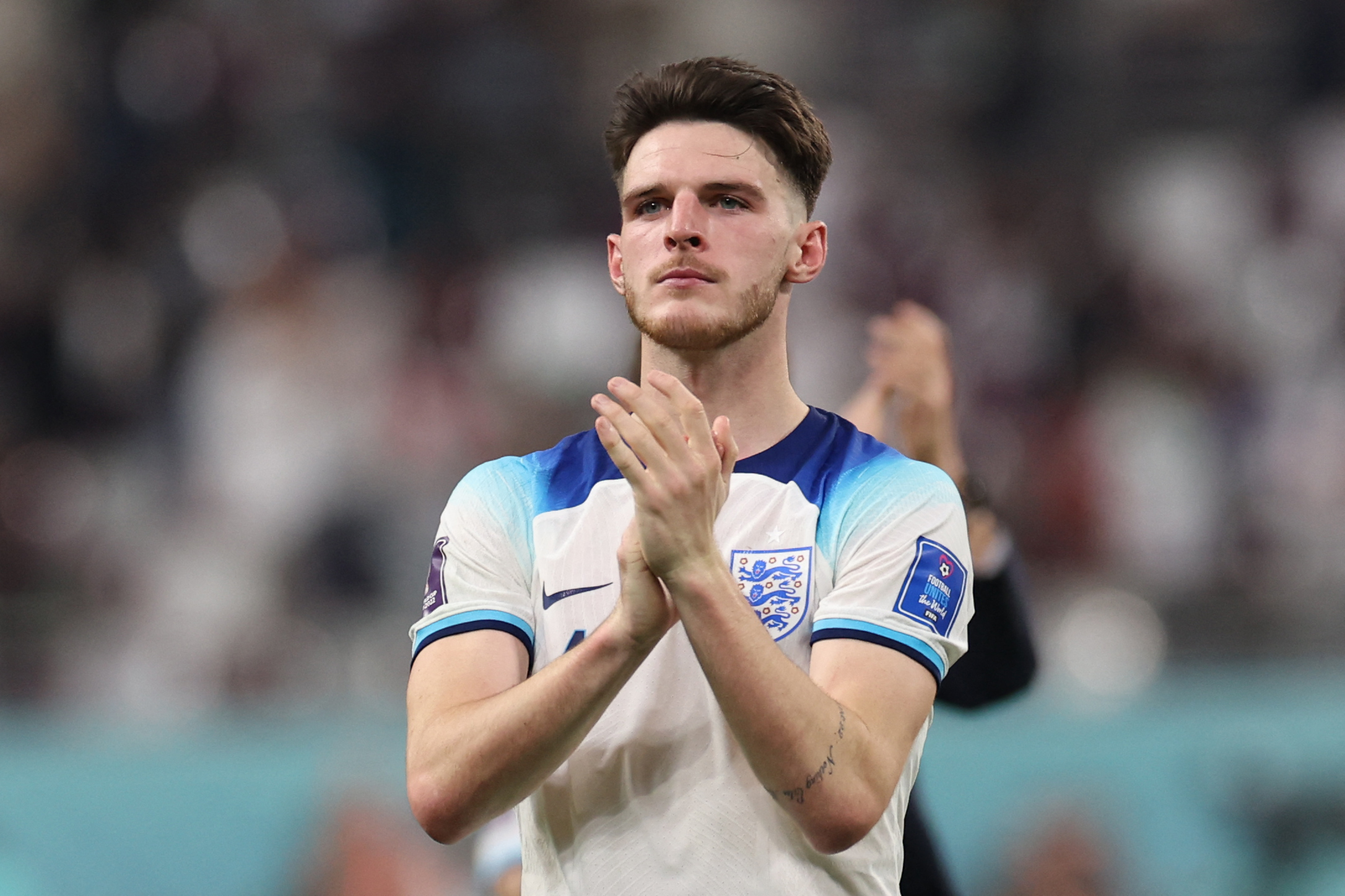 England's midfielder Declan Rice applauds supporters after the Qatar 2022 World Cup Group B football match between England and Iran at the Khalifa International Stadium in Doha on November 21, 2022.