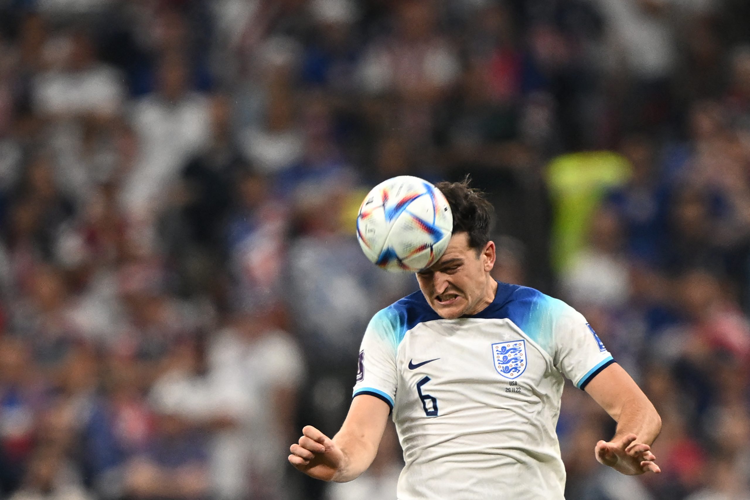 England's defender Harry Maguire heads the ball during the Qatar 2022 World Cup Group B football match between England and USA at the Al-Bayt Stadium in Al Khor, north of Doha on November 25, 2022