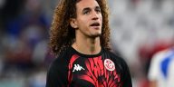 Tunisia's midfielder #08 Hannibal Mejbri warms up ahead of the Qatar 2022 World Cup Group D football match between Tunisia and France at the Education City Stadium in Al-Rayyan, west of Doha on November 30, 2022