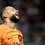 Netherlands' forward #10 Memphis Depay reacts during the Qatar 2022 World Cup round of 16 football match between the Netherlands and USA at Khalifa International Stadium in Doha on December 3, 2022
