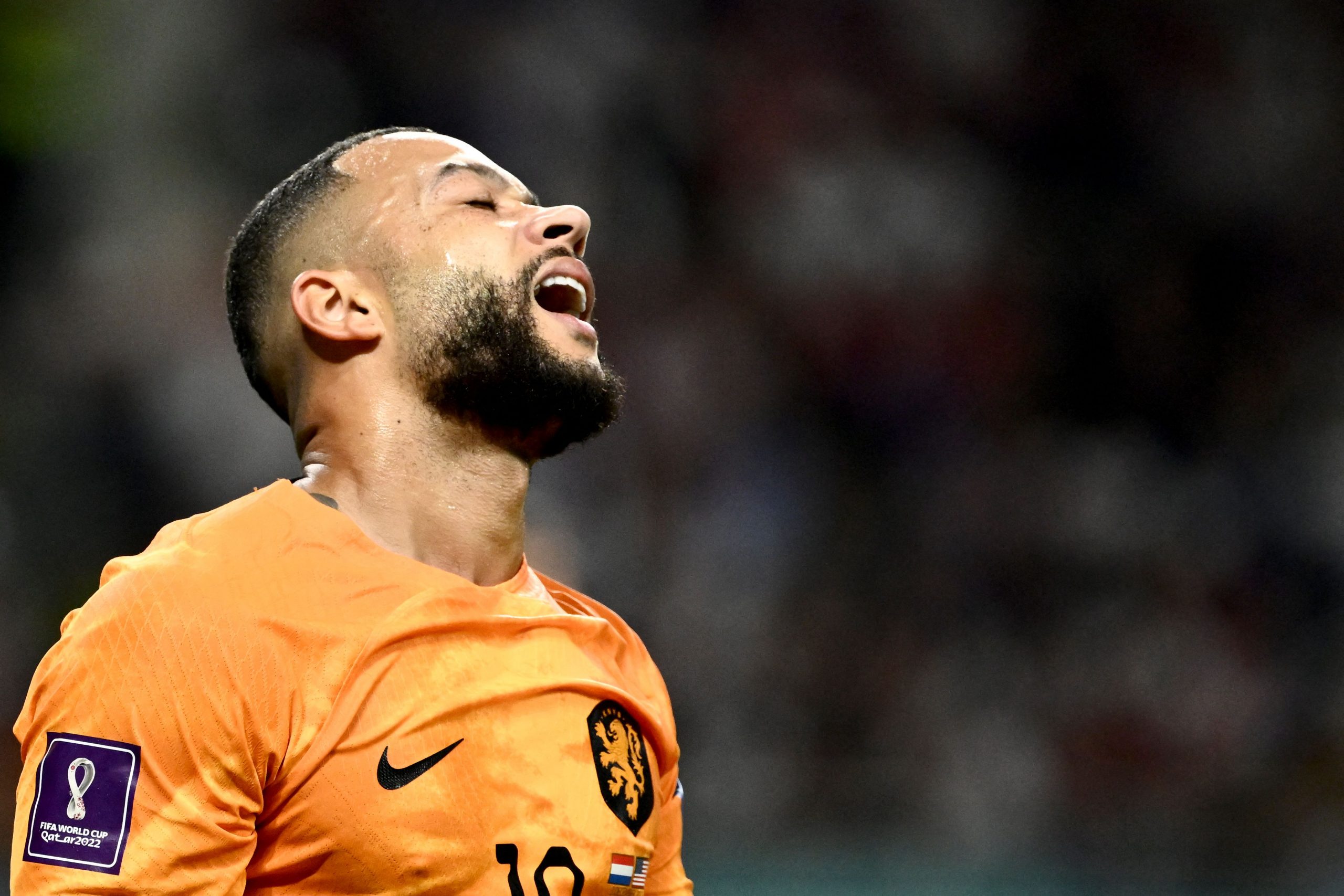 Netherlands' forward #10 Memphis Depay reacts during the Qatar 2022 World Cup round of 16 football match between the Netherlands and USA at Khalifa International Stadium in Doha on December 3, 2022