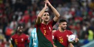 Portugal's defender Diogo Dalot applauds at the crowd after qualifying to the next round after defeating Switzerland 6-1 in the Qatar 2022 World Cup round of 16 football match between Portugal and Switzerland at Lusail Stadium in Lusail, north of Doha on December 6, 2022.