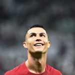 Portugal's forward Cristiano Ronaldo smiles after qualifying to the next round after defeating Switzerland 6-1 in the Qatar 2022 World Cup round of 16 football match between Portugal and Switzerland at Lusail Stadium in Lusail, north of Doha on December 6, 2022
