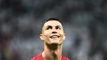 Portugal's forward Cristiano Ronaldo smiles after qualifying to the next round after defeating Switzerland 6-1 in the Qatar 2022 World Cup round of 16 football match between Portugal and Switzerland at Lusail Stadium in Lusail, north of Doha on December 6, 2022