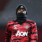 Aaron Wan-Bissaka of Manchester United looks on during his warm up prior to the Premier League match between Manchester United and Everton at Old Trafford on February 06, 2021 in Manchester, England.