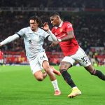 Marcus Rashford of Manchester United in action with Trent Alexander-Arnold of Liverpool during the Premier League match between Manchester United and Liverpool FC at Old Trafford on August 22, 2022 in Manchester, England.