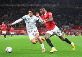 Marcus Rashford of Manchester United in action with Trent Alexander-Arnold of Liverpool during the Premier League match between Manchester United and Liverpool FC at Old Trafford on August 22, 2022 in Manchester, England.