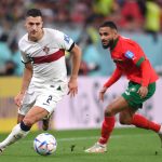Diogo Dalot of Portugal and Sofiane Boufal of Morocco during the FIFA World Cup Qatar 2022 quarter final match between Morocco and Portugal at Al Thumama Stadium on December 10, 2022 in Doha, Qatar.