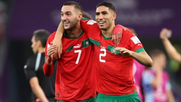 Hakim Ziyech and Achraf Hakimi of Morocco celebrate after the team's victory during the FIFA World Cup Qatar 2022 Round of 16 match between Morocco and Spain at Education City Stadium on December 06, 2022 in Al Rayyan, Qatar.