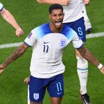 England striker Marcus Rashford celebrates with team mates after scoring the first goal during the FIFA World Cup Qatar 2022 Group B match between Wales and England at Ahmad Bin Ali Stadium on November 29, 2022 in Doha, Qatar.