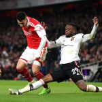 Gabriel Martinelli of Arsenal is challenged by Aaron Wan-Bissaka of Manchester United during the Premier League match between Arsenal FC and Manchester United at Emirates Stadium on January 22, 2023 in London, England