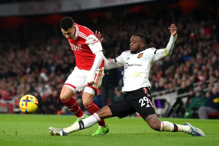 Gabriel Martinelli of Arsenal is challenged by Aaron Wan-Bissaka of Manchester United during the Premier League match between Arsenal FC and Manchester United at Emirates Stadium on January 22, 2023 in London, England