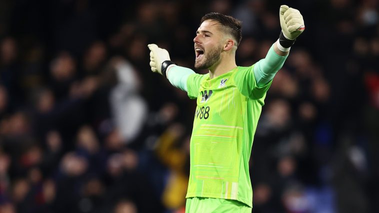 Jack Butland of Crystal Palace celebrates their sides first goal scored by team mate Wilfried Zaha during the Premier League match between Crystal Palace and Southampton at Selhurst Park on December 15, 2021 in London, England