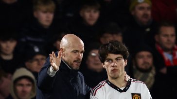 Manchester United's Dutch manager Erik ten Hag (L) gives indications to Manchester United's Uruguayan midfielder Facundo Pellistri (R) before entering the pitch during the English League Cup semi-final first-leg football match between Nottingham Forest and Manchester United, at The City Ground stadium, in Nottingham, central England, on January 25, 2023.