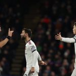 Manchester United's Portuguese midfielder Bruno Fernandes (C) argues with referee Robert Jones (L) following a foul commited on Manchester United's Scottish midfielder Scott McTominay (R) during the English Premier League football match between Crystal Palace and Manchester United at Selhurst Park in south London on January 18, 2023