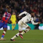 Manchester United's English defender Aaron Wan-Bissaka (R) runs with the ball during the English Premier League football match between Crystal Palace and Manchester United at Selhurst Park in south London on January 18, 2023