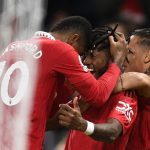 Manchester United's Brazilian midfielder Fred celebrates with Manchester United's English striker Marcus Rashford after scoring his team first goal during the English Premier League football match between Manchester United and Tottenham Hotspur at Old Trafford in Manchester, north west England, on October 19, 2022