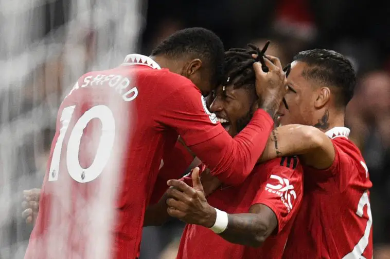 Manchester United's Brazilian midfielder Fred celebrates with Manchester United's English striker Marcus Rashford after scoring his team first goal during the English Premier League football match between Manchester United and Tottenham Hotspur at Old Trafford in Manchester, north west England, on October 19, 2022