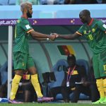 Cameroon's forward Eric Maxim Choupo-Moting hands the captain's armband to Cameroon's forward #10 Vincent Aboubakar after being substituted during the Qatar 2022 World Cup Group G football match between Switzerland and Cameroon at the Al-Janoub Stadium in Al-Wakrah, south of Doha on November 24, 2022.