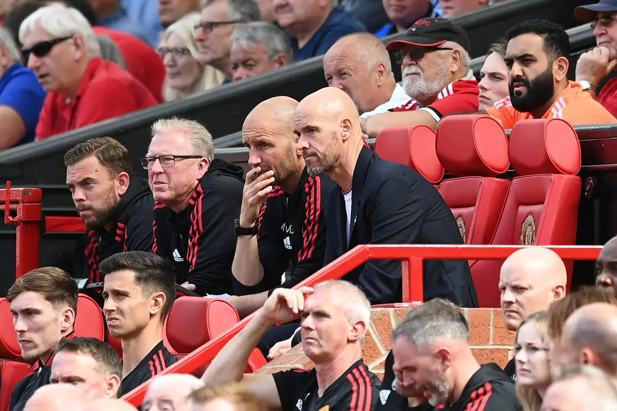 Assistants Steve McLaren and Mitchell van der Gaag look on next to Erik ten Haag, Manager of Manchester United during the Premier League match between Manchester United and Brighton & Hove Albion at Old Trafford on August 07, 2022 in Manchester, England.