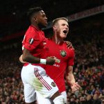 Scott McTominay of Manchester United celebrates with teammate Fred of Manchester United after scoring his team's third goal during the UEFA Europa League round of 32 second leg match between Manchester United and Club Brugge at Old Trafford on February 27, 2020 in Manchester, United Kingdom