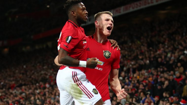 Scott McTominay of Manchester United celebrates with teammate Fred of Manchester United after scoring his team's third goal during the UEFA Europa League round of 32 second leg match between Manchester United and Club Brugge at Old Trafford on February 27, 2020 in Manchester, United Kingdom
