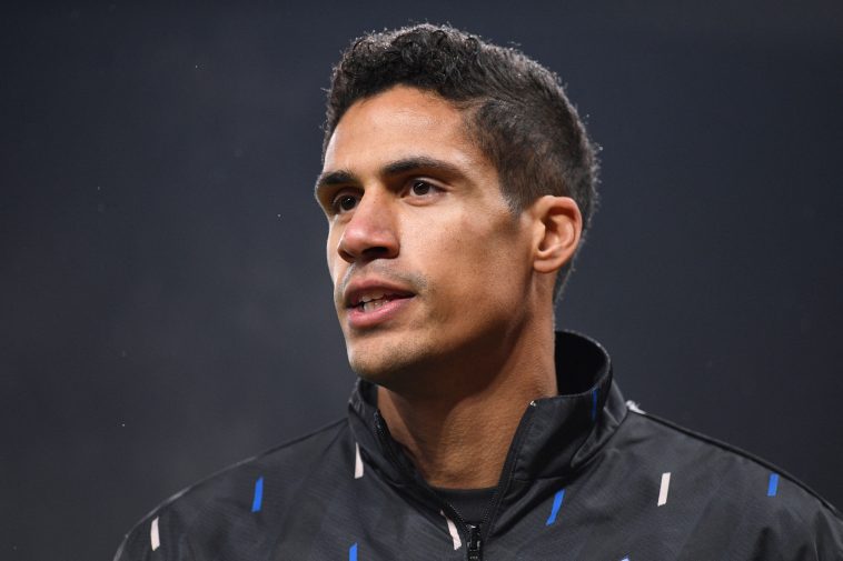 Manchester United's French defender Raphael Varane warms up ahead of the English FA Cup fourth round football match between Manchester United and Reading at Old Trafford in Manchester, north west England, on January 28, 2023