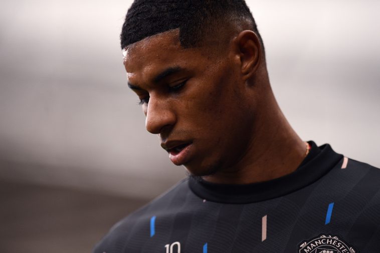 Manchester United's English striker Marcus Rashford warms up ahead of the English Premier League football match between Manchester United and Leicester City at Old Trafford in Manchester, north west England, on February 19, 2023