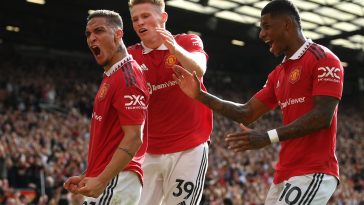 Antony of Manchester United celebrates with team mates Scott McTominay and Marcus Rashford after scoring during the Premier League match between Manchester United and Arsenal FC at Old Trafford on September 04, 2022 in Manchester, England