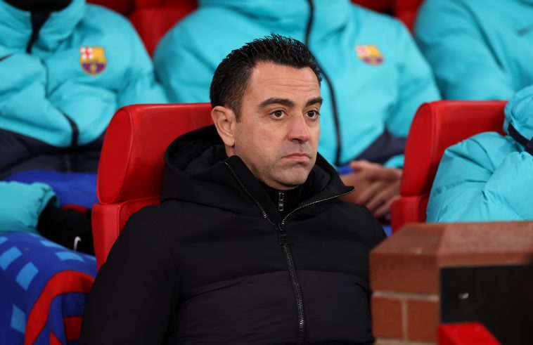 Xavi, head coach of FC Barcelona, looks on prior to the UEFA Europa League knockout round play-off leg two match between Manchester United and FC Barcelona at Old Trafford on February 23, 2023 in Manchester, England.