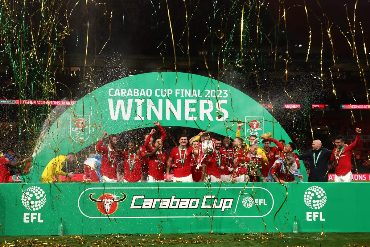 Bruno Fernandes and Harry Maguire of Manchester United lift the Carabao Cup trophy.