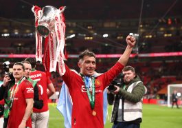 Lisandro Martinez of Manchester United celebrates with the Carabao Cup trophy following victory in the Carabao Cup Final match between Manchester United and Newcastle United at Wembley Stadium on February 26, 2023 in London, England