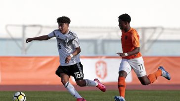 Mehdi Loune (L) of Germany battles for the ball with Amourricho Van Axel Dongen of Netherlands.