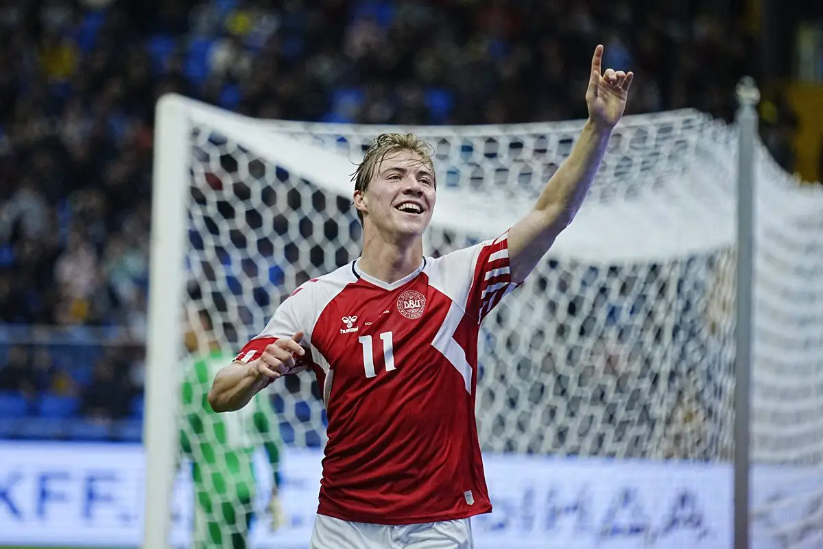 Manchester United striker Rasmus Hojlund addresses the fans after Denmark secured victory against Finland