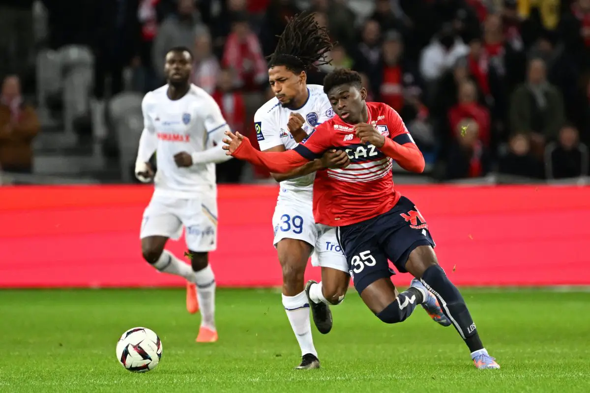 Lille's Cameroonian midfielder Carlos Baleba (R) fights for the ball with Troyes' French defender Yasser Larouci during the French L1 football match between Lille LOSC and ES Troyes AC at Stade Pierre-Mauroy in Villeneuve-d'Ascq, northern France on January 15, 2023