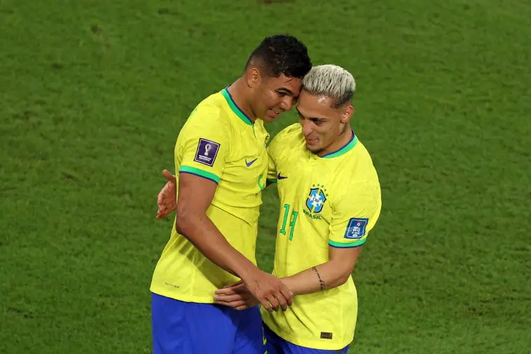 Brazil's midfielder #05 Casemiro celebrates with his teammate forward #19 Antony after scoring his team's first goal during the Qatar 2022 World Cup Group G football match between Brazil and Switzerland at Stadium 974 in Doha on November 28, 2022