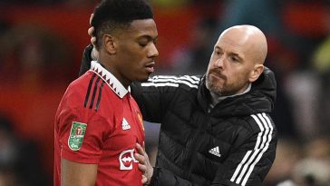 Manchester United's French striker Anthony Martial is greeted by Erik ten Hag.
