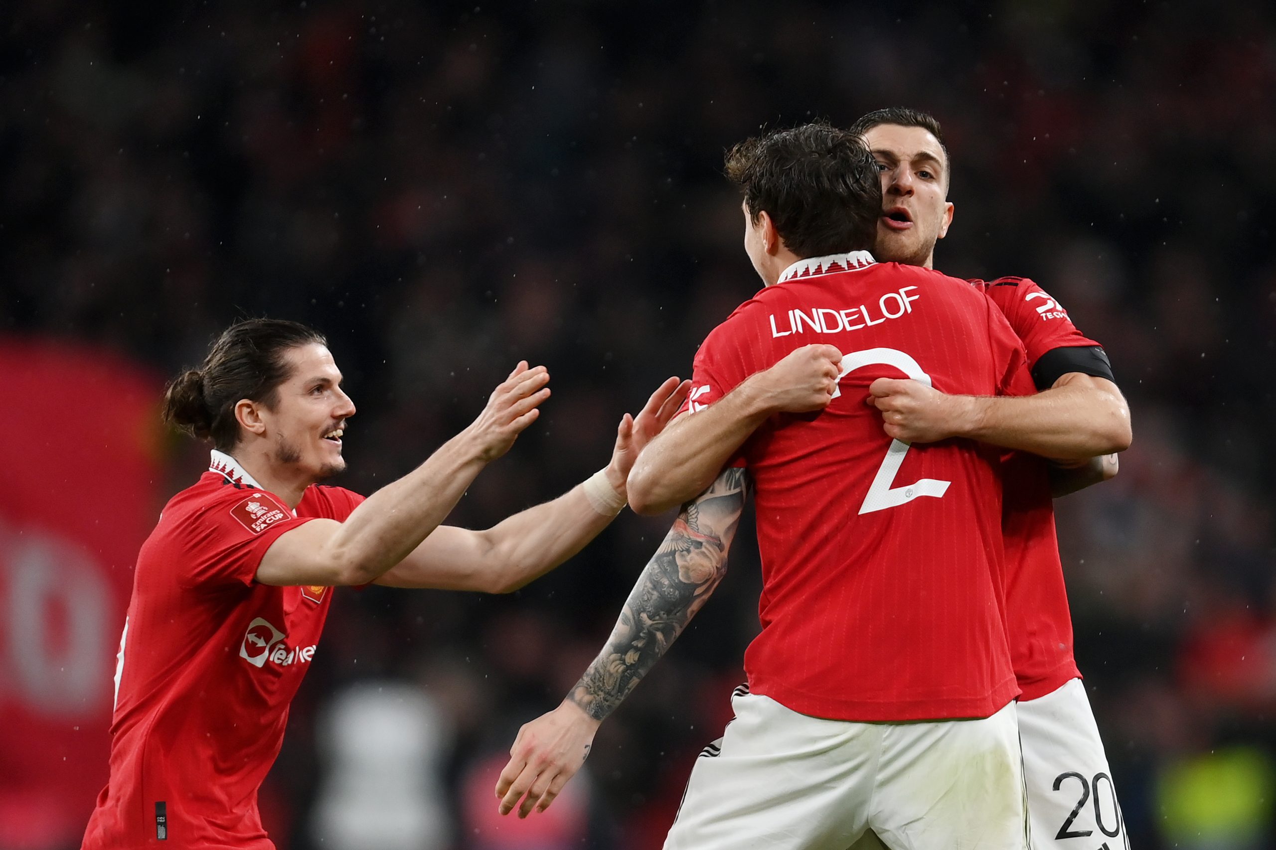 Marcel Sabitzer, Victor Lindelof and Diogo Dalot of Manchester United celebrate.