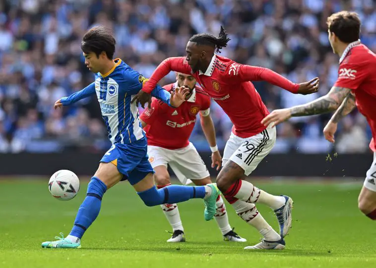 Manchester United defender Aaron Wan-Bissaka and Brighton's Kaoru Mitoma.