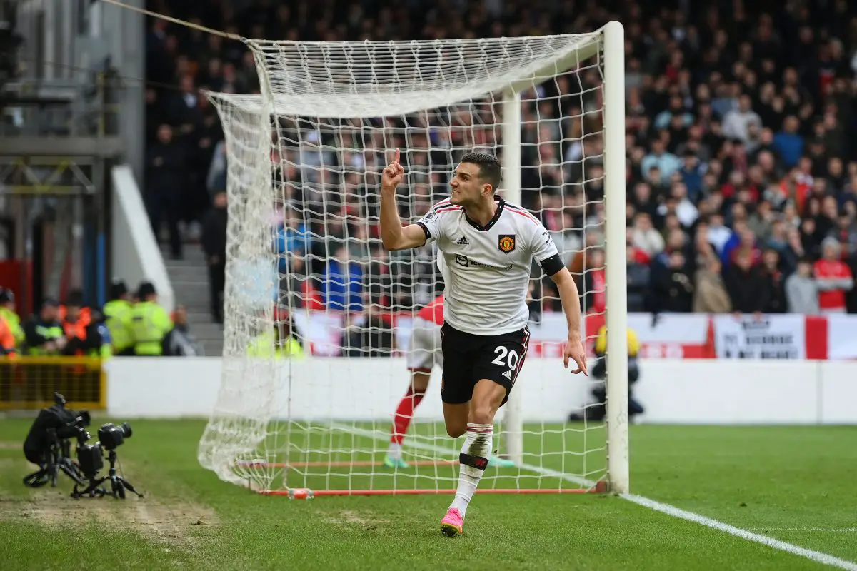 NOTTINGHAM, ENGLAND - APRIL 16: Diogo Dalot of Manchester United celebrates after scoring the team's second goal during the Premier League match between Nottingham Forest and Manchester United at City Ground on April 16, 2023 in Nottingham, England. 