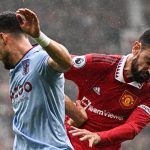 Aston Villa's Spanish defender Alex Moreno (L) fights for the ball with Manchester United's Portuguese midfielder Bruno Fernandes. (Photo by OLI SCARFF/AFP via Getty Images)