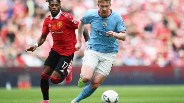 Kevin De Bruyne of Manchester City runs with the ball whilst under pressure from Fred of Manchester United during the Emirates FA Cup Final.