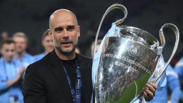 Manchester City's Spanish manager Pep Guardiola celebrates with the European Cup trophy. (Photo by FRANCK FIFE/AFP via Getty Images)