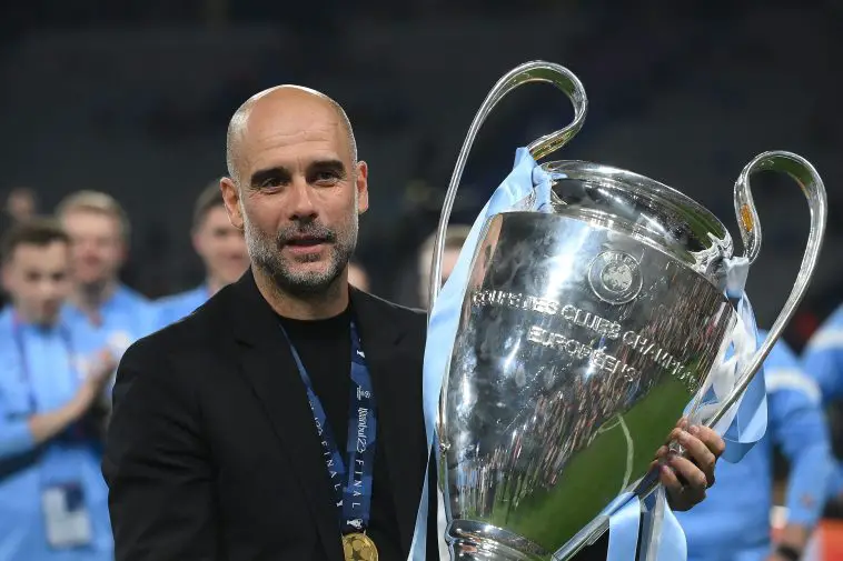 Manchester City's Spanish manager Pep Guardiola celebrates with the European Cup trophy. (Photo by FRANCK FIFE/AFP via Getty Images)