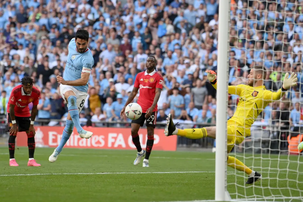 Ilkay Guendogan of Manchester City scores a goal past David De Gea of Manchester United, which was later disallowed for offside. 