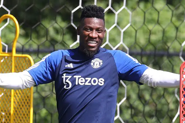 Andre Onana pulls on Man United training gear for the first time (Image: Matthew Peters/Manchester United via Getty Images)