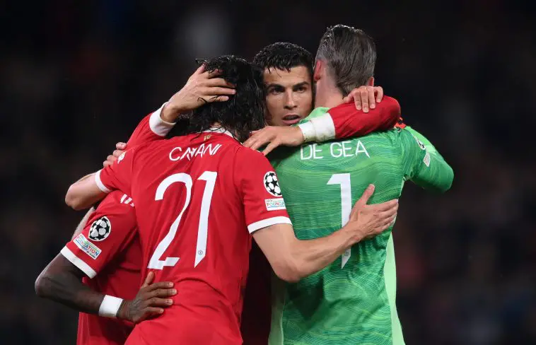 Cristiano Ronaldo of Manchester United celebrates their side's victory with Edinson Cavani and David De Gea.