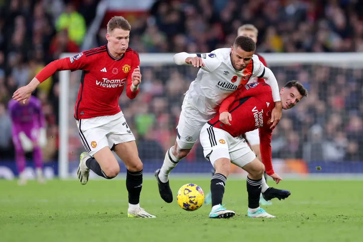 MANCHESTER, ENGLAND - NOVEMBER 11: Carlton Morris of Luton Town is challenged by Mason Mount of Manchester United during the Premier League match between Manchester United and Luton Town at Old Trafford on November 11, 2023 in Manchester, England. (Photo by Alex Livesey/Getty Images)